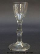 Georgian drinking glass with ogee bowl over knopped stem raised on folded foot, 14.8cm tall.