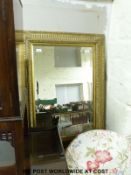 A bevelled glass gilt framed mirror (H100cm x W72cm)