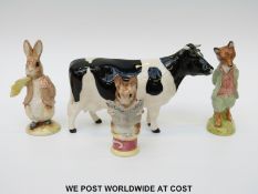 Beswick Freisian cow and three Beswick Beatrix Potter figures