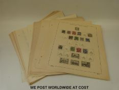 A collection of German stamps on loose Schaubek album pages