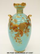 Royal Crown Derby twin handled vase with gilded decoration on an aqua ground (19.
