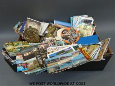 A large quantity of postcards mostly tourist locations to include Devon, Dorset, Wiltshire,