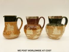 Doulton Lambeth silver mounted salt glazed jugs decorated with hunting scenes including one for