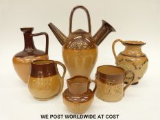 Doulton Lambeth salt glazed jugs to include one with motto 'He Who Buys Land Buys Stones,