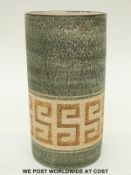 An Avril Bennett Troika cylinder vase with sand and green coloured textured decoration in Greek key