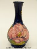 Moorcroft vase in Magnolia pattern on a blue ground (15.