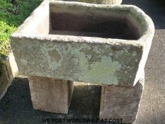 A 'D' end stone trough on double stone bases (62cm x 76cm)