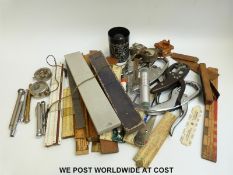 A quantity of rulers, slide rules etc to include ivory examples, printer's rule,