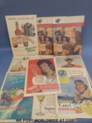 A collection of advertising boards including Chesterfield cigarettes, Camel, Seagrams distilled gin,