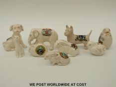 Eight crested ware ceramic animals to include Florentine elephant City of Hereford,