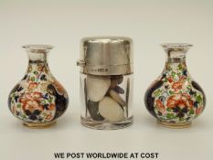A pair of silver mounted Crown Derby Imari pattern bud vases together with a silver mounted glass