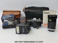 A Canon AE1 Program SLR camera, Vivitar 28- 85mm f 2.8/ 3.