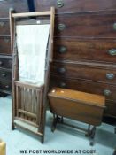 A vintage mahogany framed steamer style deck chair and a Sutherland table