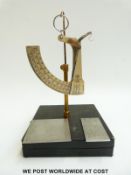 A cased H E Messmer Ltd paper or similar scale with segment dial and two sample templates