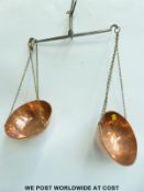 Two sets of travelling beam scales with copper pans