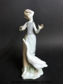 A Lladro goose girl figurine