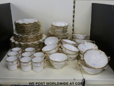 A collection of Royal Crown Derby dinner and tea ware in Lombardy pattern (1127) with jewelled