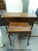 A 19thc mahogany drop leaf table raised on cabriole legs