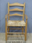 An Arts and Crafts Neville Neal rush seated peg jointed ash ladder back child's chair