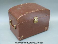 A leather travelling jewellery case with drawers, ring trays, mirror, etc.