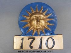 A Sun Alliance firemark with impressed 17.