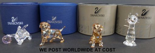 Four Swarovski animals comprising a puppy, kitten with ball,