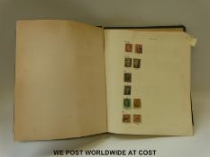 An album containing a collection of stamps from the USA, Spain & colonies, Romania, Japan,