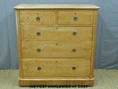 A Victorian satinwood chest of two over three graduated drawers with brass looped drop handles
