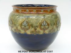 Royal Doulton jardiniere with Art Nouveau decoration above blue ground,