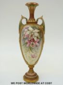Royal Worcester twin handled pedestal vase hand decorated with orchids and with jewelled panels,