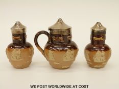 Doulton Lambeth salt glazed hallmarked silver mounted three piece cruet (tallest 8.