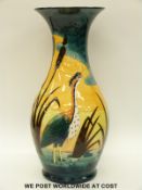 Moorcroft Prestige vase decorated with heron, duck and bulrushes, signed J Moorcroft P R Des 4.10.