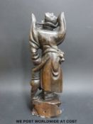 A 19th / 20thC silver wire inlaid hardwood figure of an emaciated immortal beneath a larger figure