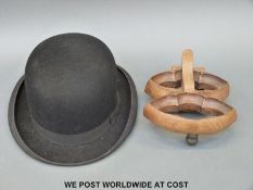 Bowler hat and a carved wooden door knocker