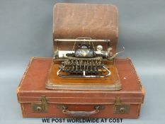 A vintage Blickenderfer typewriter and a leather suitcase