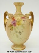 Royal Worcester blush ivory twin handled pedestal vase decorated with flowers,