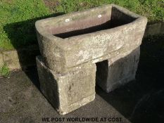 A 'D' stone trough on double stone bases (42cm x 92cm)