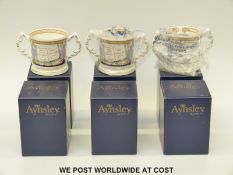 Six Aynsley limited edition Royal commemorative loving cups celebrating the birth of Prince George,