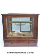 A Knowles Patent Yarn balance in glass case by Goodbrand & Co Manchester