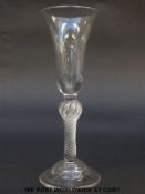 George II drinking glass with elongated bell bowl over multi-spiral air twist stem raised on domed