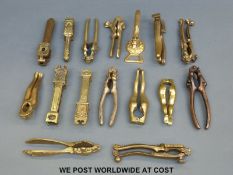 A quantity of brass and other novelty nutcrackers to include legs,