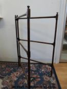 A 19thC mahogany towel rail (H101cm x width closed 68cm)