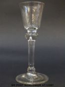 George I drinking glass with round funnel bowl over baluster shouldered knopped stem raised on