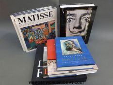A collection of books to include Robert Descharnes, Gilles Neret, Dali,