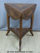 An Edwardian inlaid rosewood cricket table with gallery under (H69 x diameter when extended 70cm)