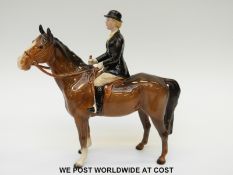 Beswick huntswoman on a brown standing horse