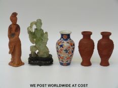A pair of terracotta Yixing vases, a terracotta figure of Guanyin,