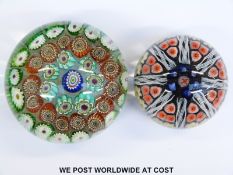 Two millefiori glass paperweights, one by Vasart with latticino tubes (6.