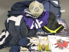 A collection of Tottenham Hotspur shirts, scarves, hats, jackets, sports bags,