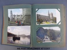 A postcard album of Edwardian postcards to include London, Eastbourne Beach, Cardiff,